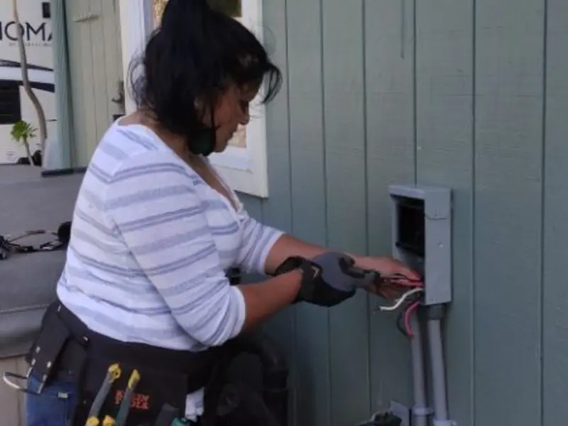 Licensed electrician wiring an exterior subpanel in Fort Madison