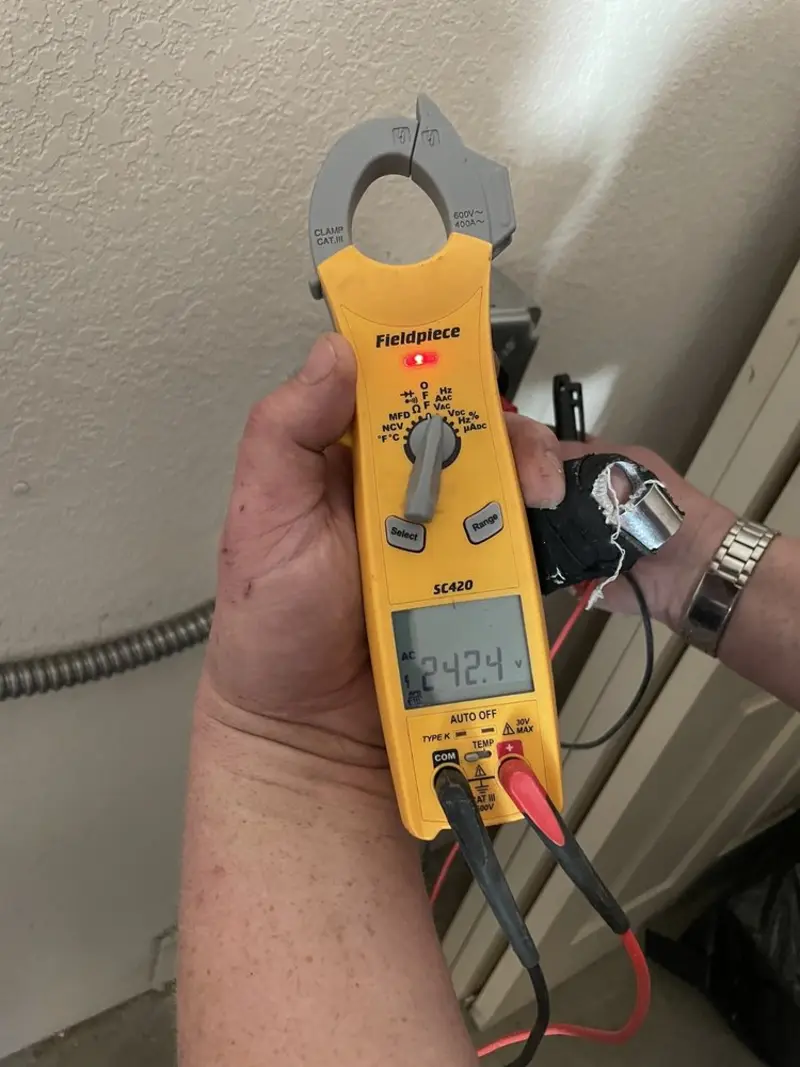 Voltage testing with clamp meter during Electrical Installation Services in Fort Madison
